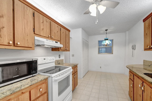 kitchen featuring a textured ceiling, electric range, ceiling fan with notable chandelier, and decorative light fixtures