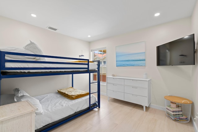 bedroom with light hardwood / wood-style floors