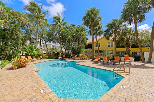 view of swimming pool featuring a patio area