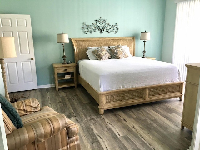 bedroom featuring dark wood-type flooring