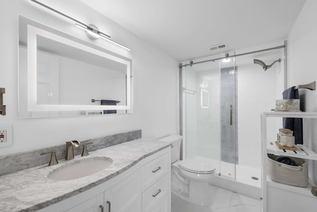 bathroom featuring toilet, vanity, and walk in shower