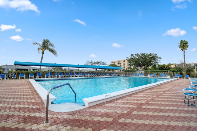 view of swimming pool featuring a patio area