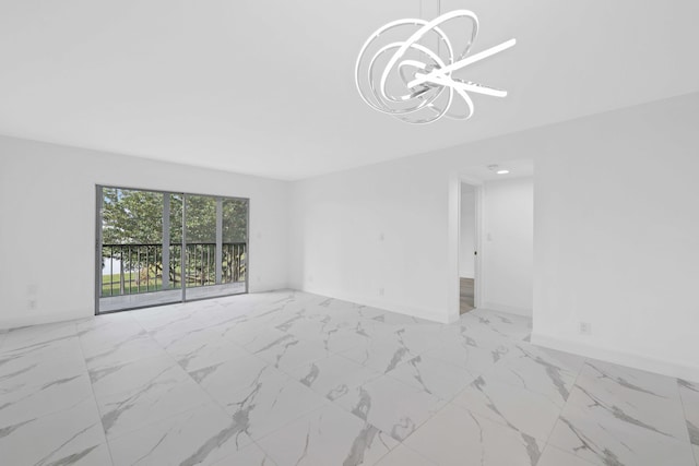 unfurnished living room with a chandelier