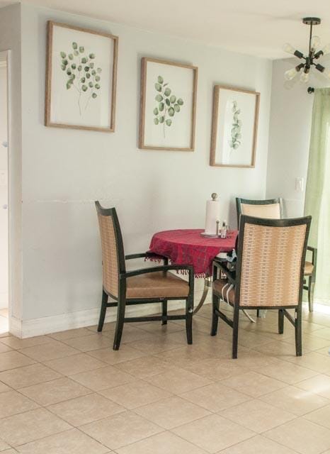 dining space featuring light tile patterned flooring