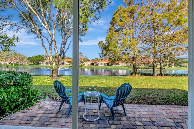 view of patio / terrace with a water view