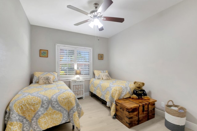 bedroom featuring ceiling fan and light hardwood / wood-style flooring