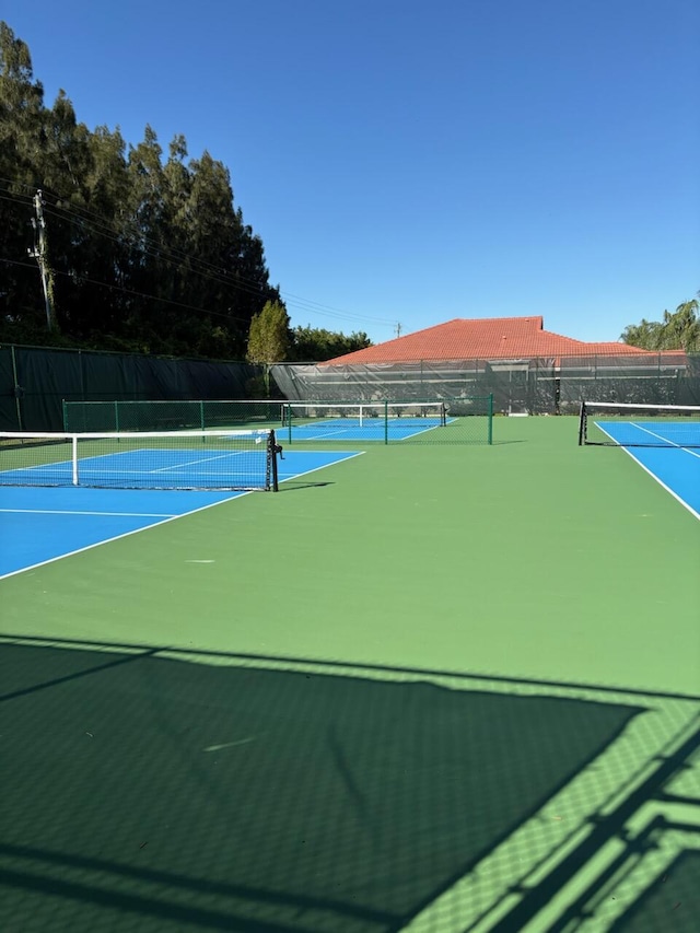 view of sport court with basketball hoop