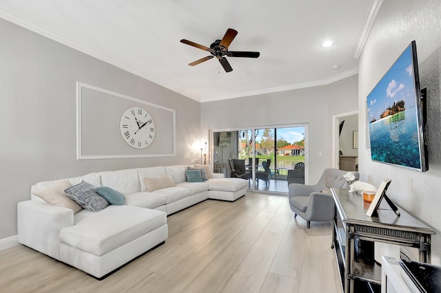 living room featuring light wood-type flooring, ceiling fan, and ornamental molding