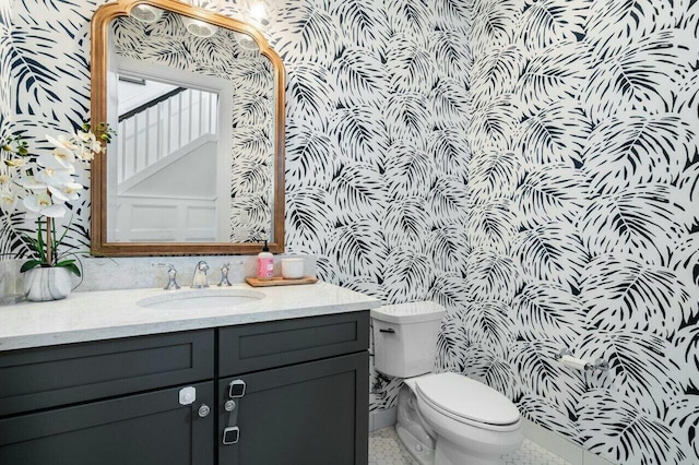 bathroom with vanity and toilet