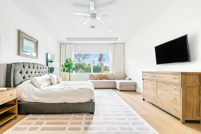 bedroom with ceiling fan and light hardwood / wood-style floors