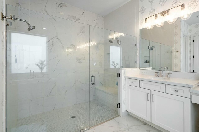 bathroom with vanity and a shower with door