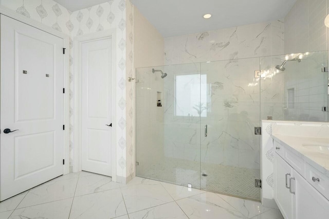 bathroom featuring vanity and a shower with shower door