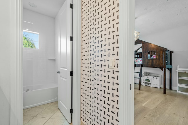 corridor with light hardwood / wood-style floors