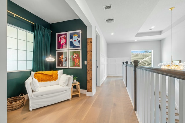 corridor with hardwood / wood-style floors