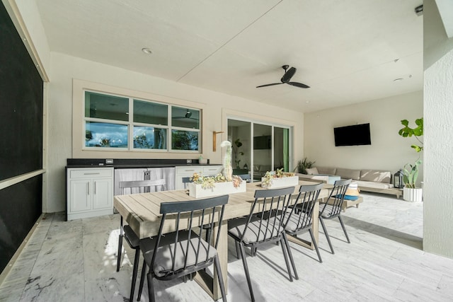 view of patio with ceiling fan and an outdoor living space