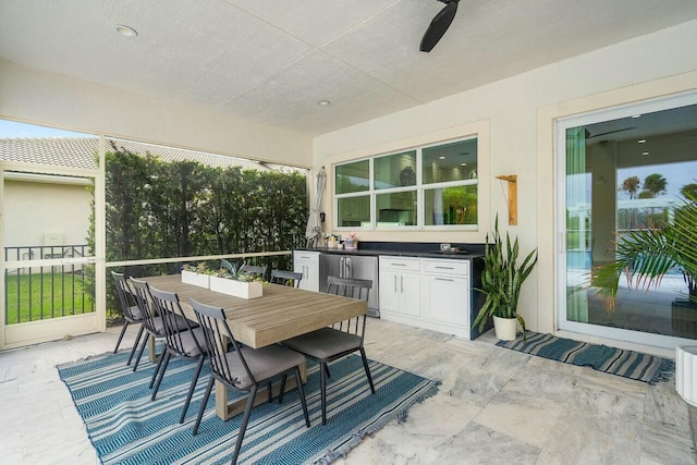 view of patio featuring ceiling fan