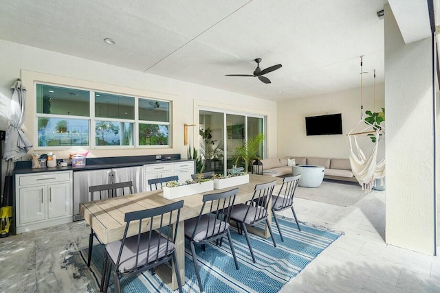 view of patio / terrace with an outdoor living space, ceiling fan, and exterior kitchen