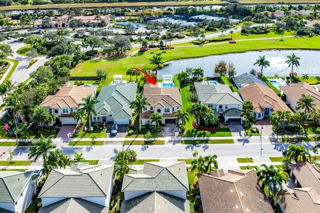 birds eye view of property featuring a water view