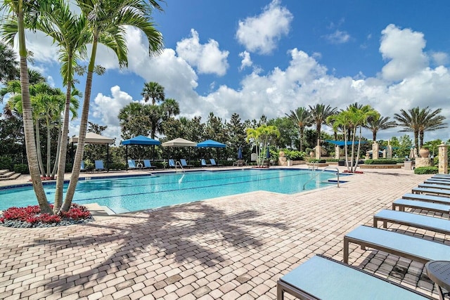 view of pool with an in ground hot tub