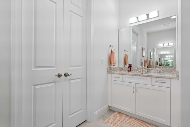 bathroom with vanity and tile patterned floors