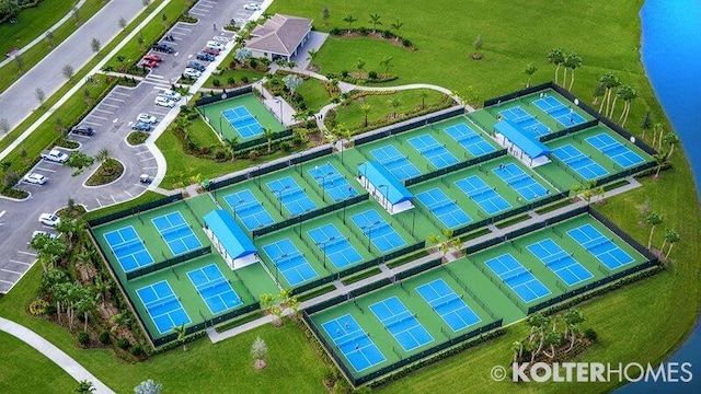 birds eye view of property with a water view