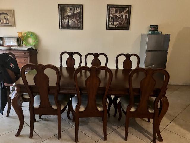 dining space with light tile patterned floors