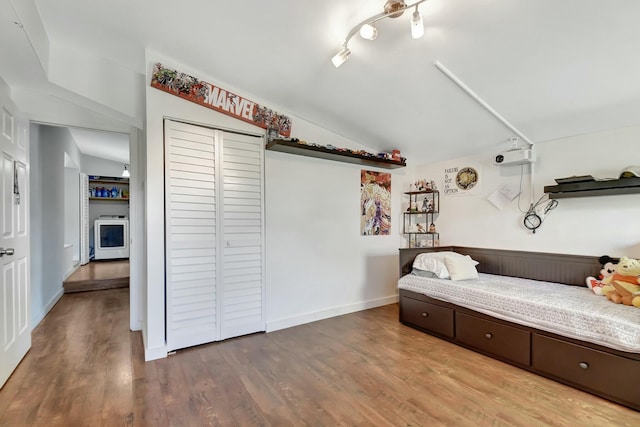 living area with hardwood / wood-style floors and lofted ceiling