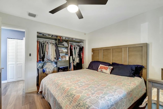 bedroom featuring hardwood / wood-style floors and ceiling fan