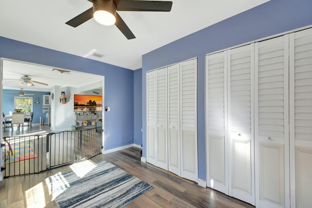 interior space featuring dark hardwood / wood-style floors and ceiling fan