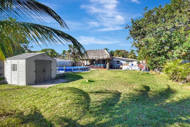 view of yard featuring a storage shed