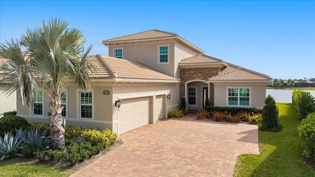 mediterranean / spanish house featuring a garage