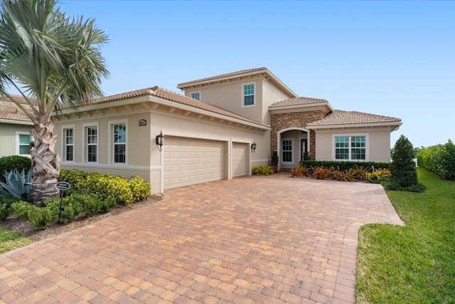 mediterranean / spanish house featuring a garage