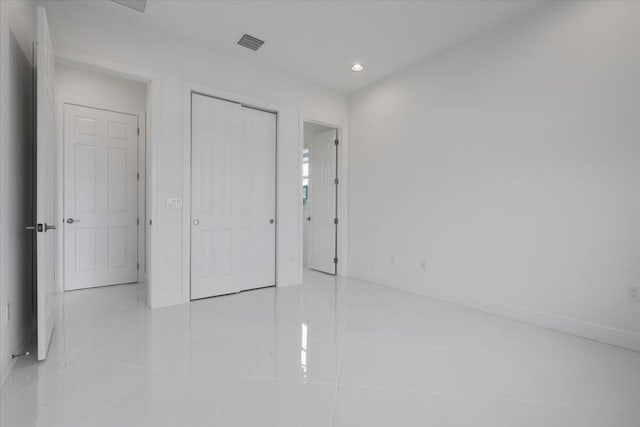 unfurnished bedroom featuring light tile patterned floors