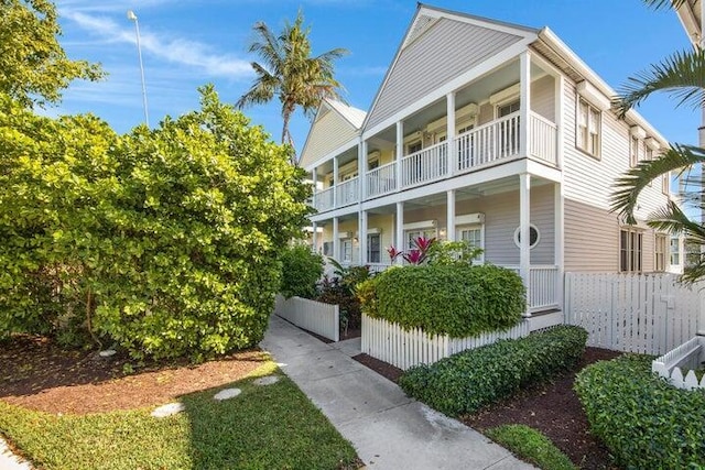 view of front of house featuring a balcony