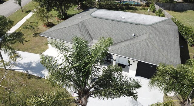 view of front of home with a front yard and a garage