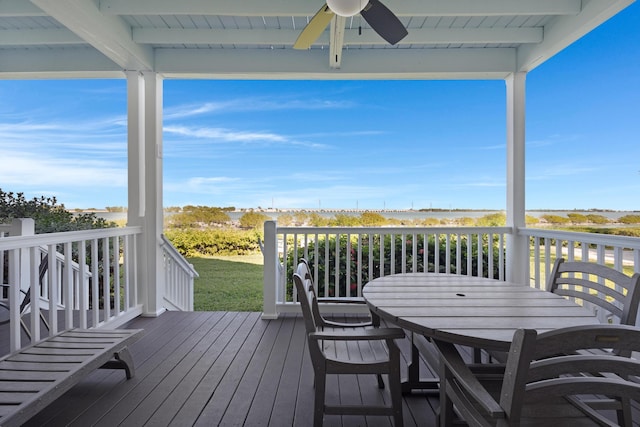 deck featuring a ceiling fan and outdoor dining space