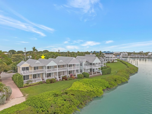 birds eye view of property with a water view