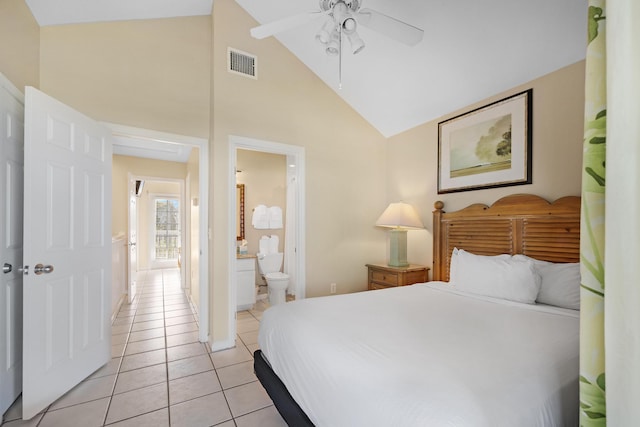 bedroom featuring light tile patterned floors, high vaulted ceiling, connected bathroom, visible vents, and a ceiling fan