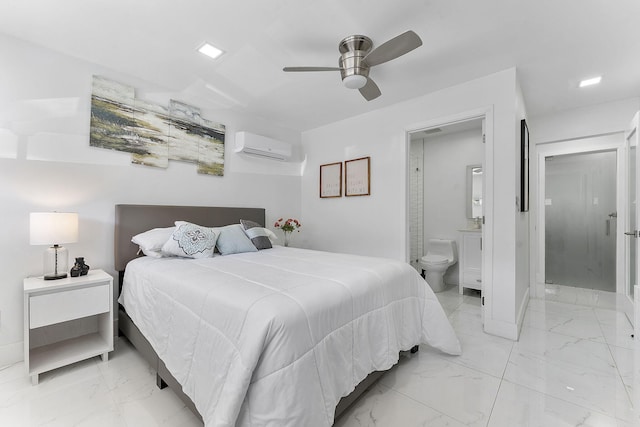 bedroom featuring a wall mounted air conditioner, ceiling fan, and ensuite bath