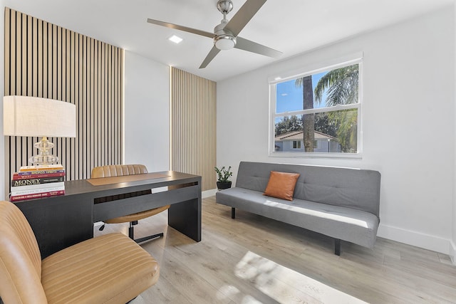 office area with ceiling fan and light hardwood / wood-style flooring