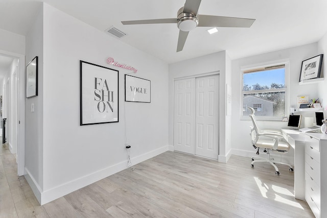 home office featuring ceiling fan and light hardwood / wood-style floors