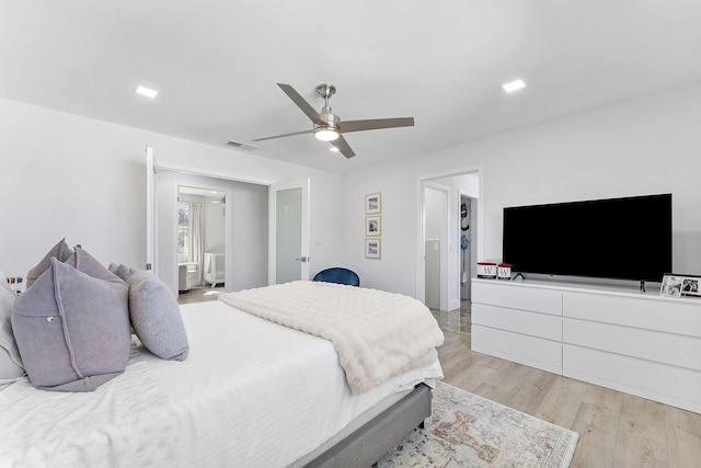 bedroom with ceiling fan and light wood-type flooring