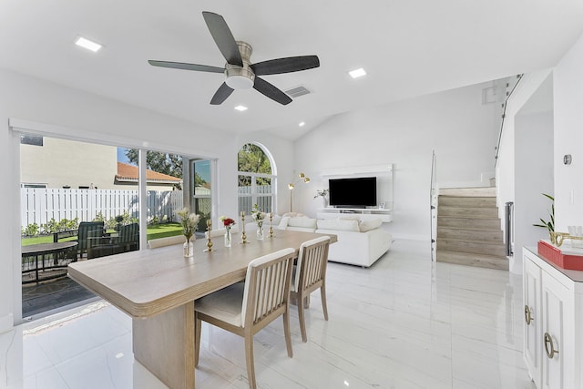 dining space featuring ceiling fan and vaulted ceiling