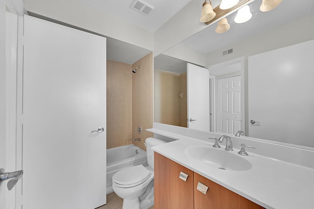 full bathroom with tile patterned flooring, vanity, toilet, and tiled shower / bath