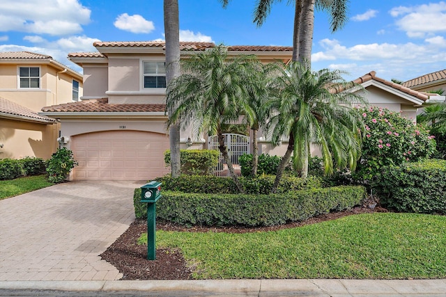 mediterranean / spanish-style home featuring a garage