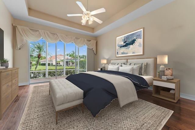 bedroom featuring access to exterior, a tray ceiling, ceiling fan, and dark hardwood / wood-style floors