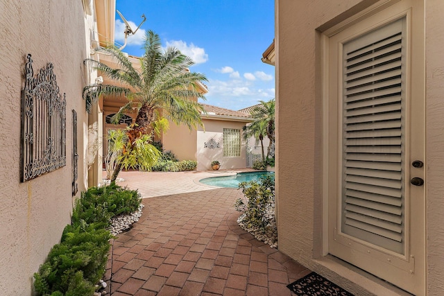 view of swimming pool with a patio