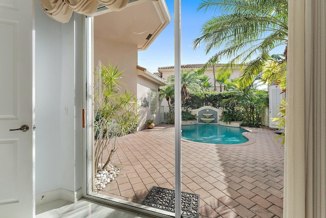 view of swimming pool featuring a patio