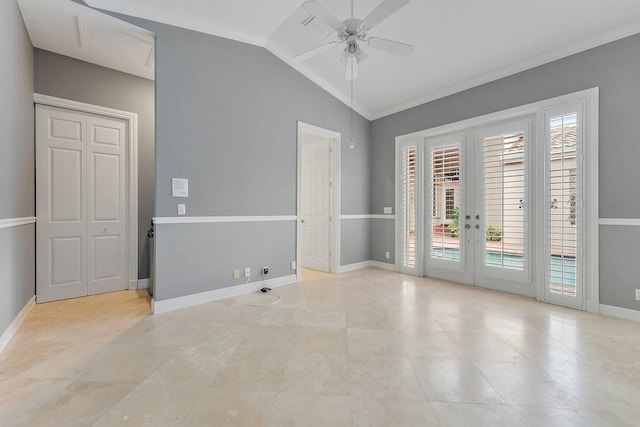 spare room featuring french doors, ornamental molding, ceiling fan, and lofted ceiling