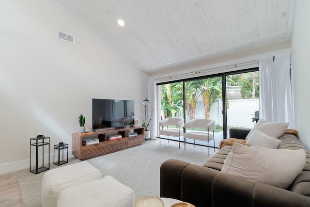 living room featuring high vaulted ceiling